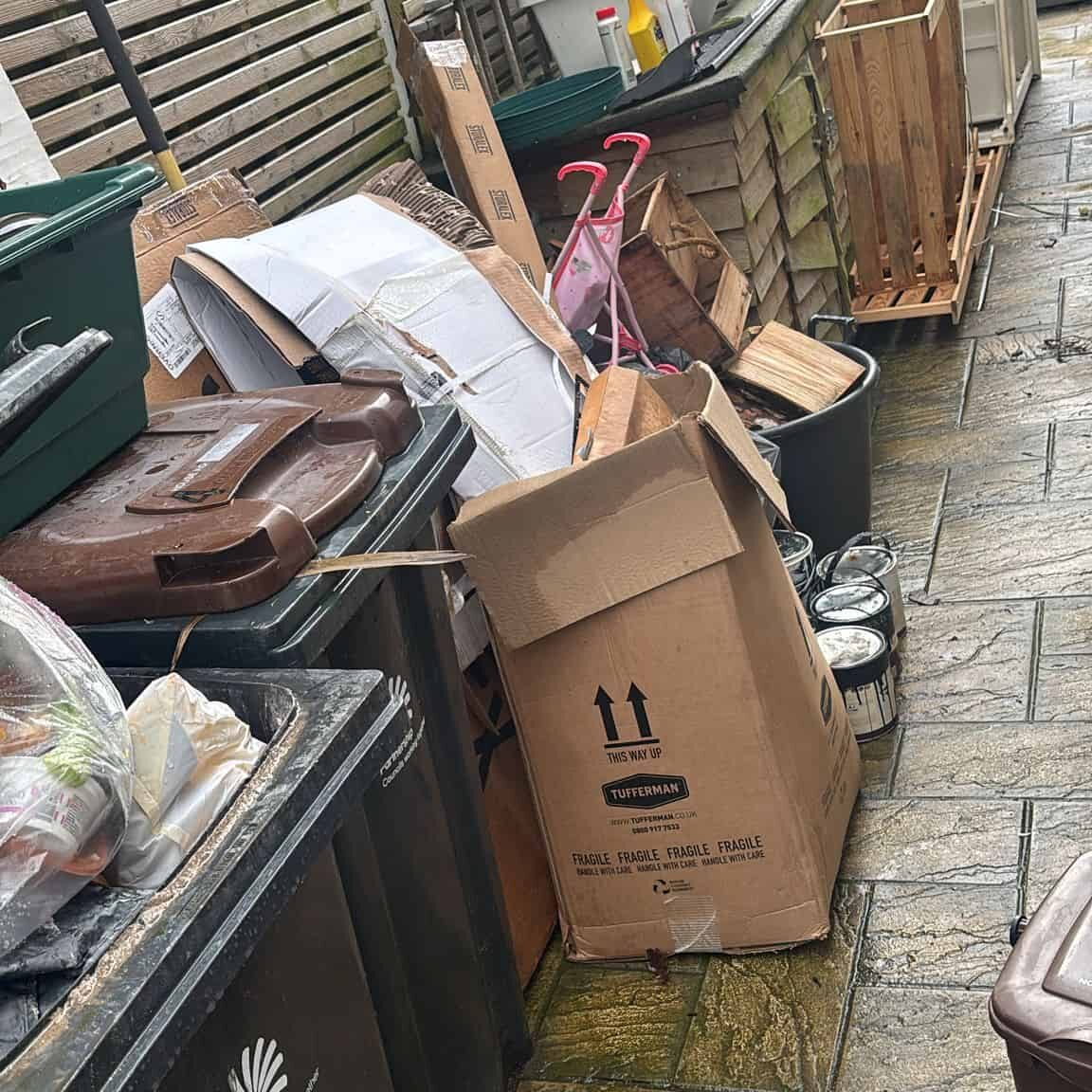 House clearance waste including furniture, boxes, and household items. Professional waste removal se.