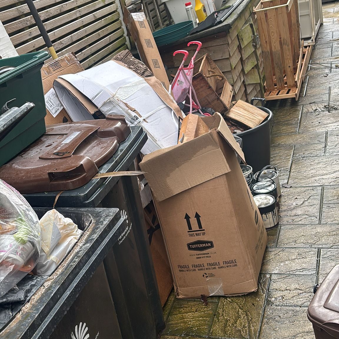 House clearance waste including furniture, boxes, and household items. Professional waste removal se.